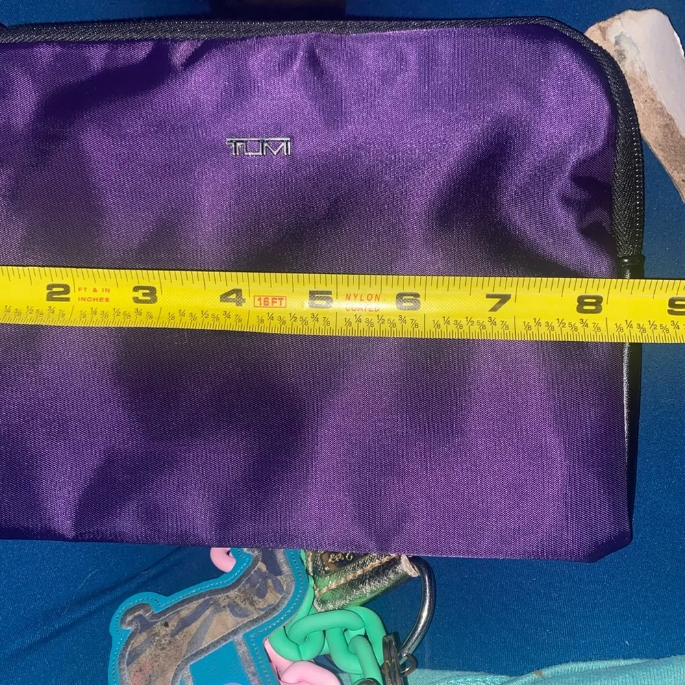 Tumi for delta travel purple bag